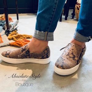 Very G brand slip on sneakers with side zip and snake skin pattern.
